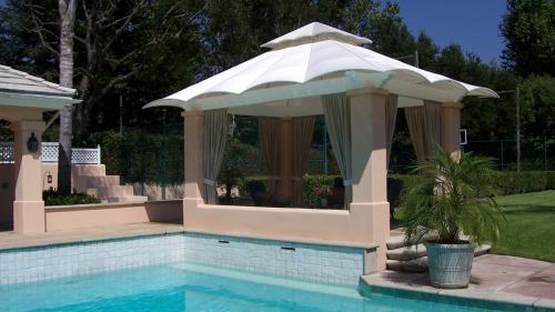 A poolside residential awning keeps you cool in the summer